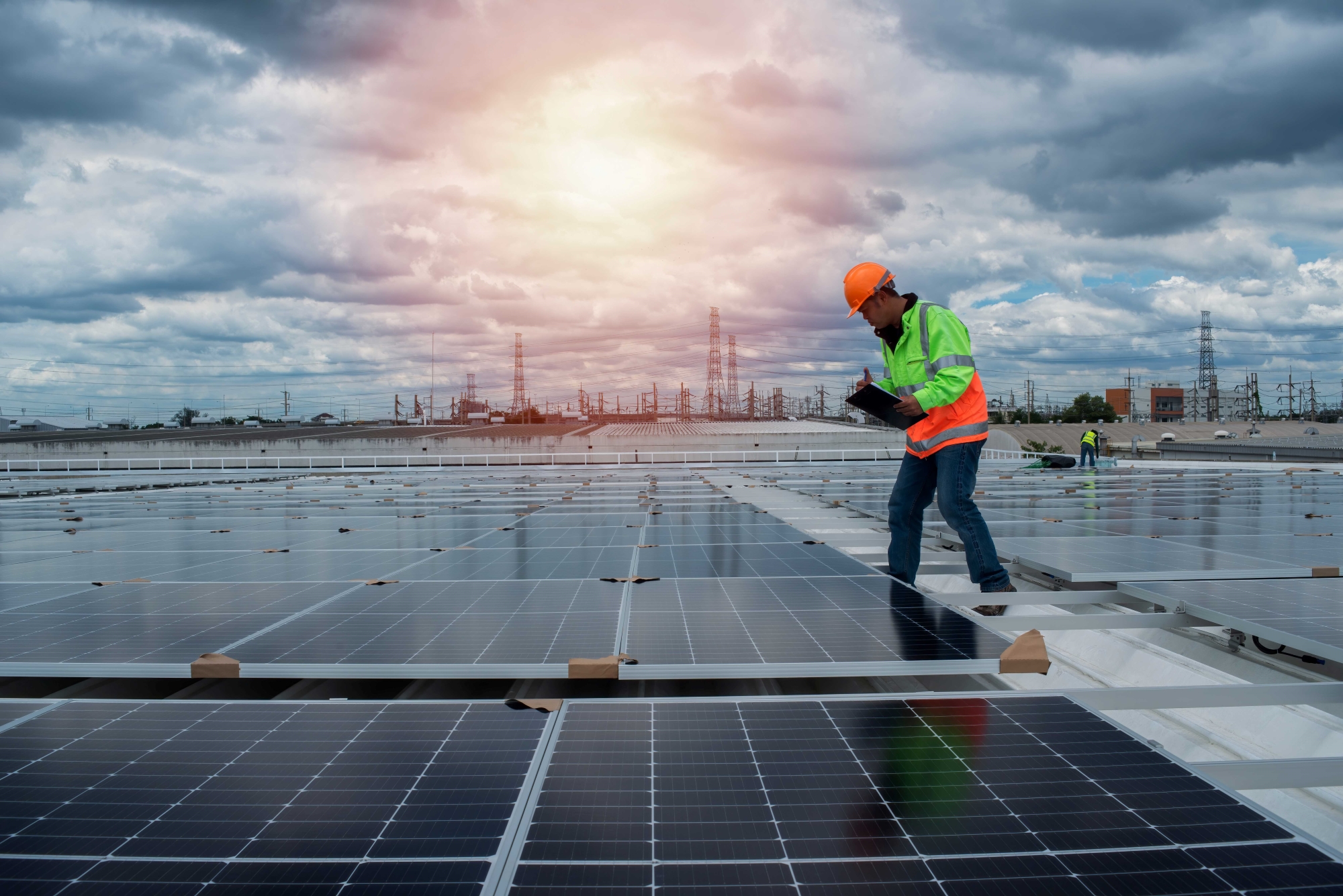 A worker inspects solar panels