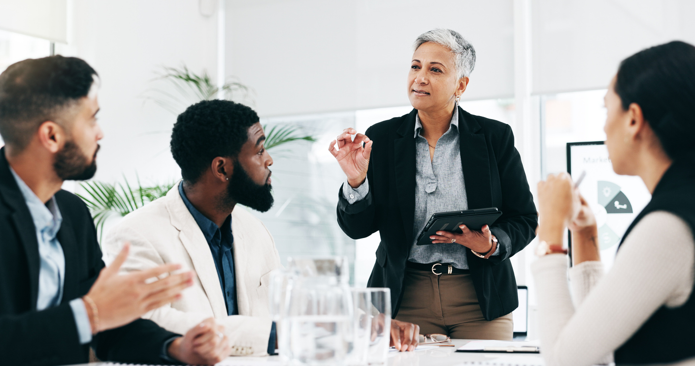 Manager in a meeting speaking to staff